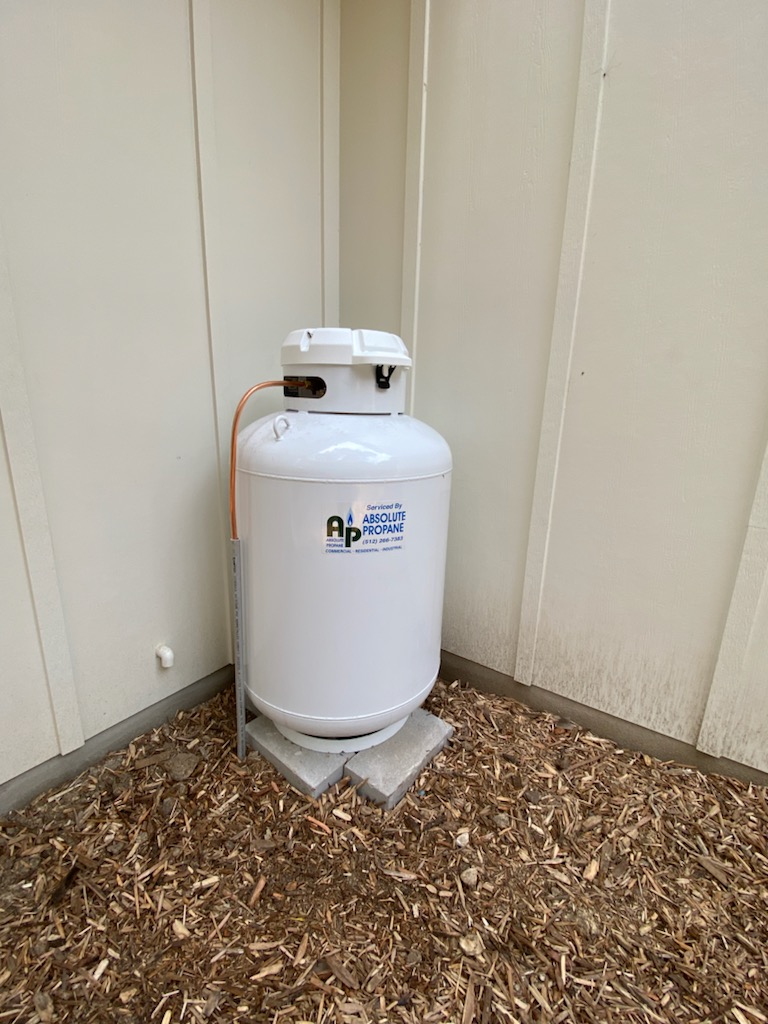 Large above-ground propane storage tank — Absolute Propane tank exchange and refill service