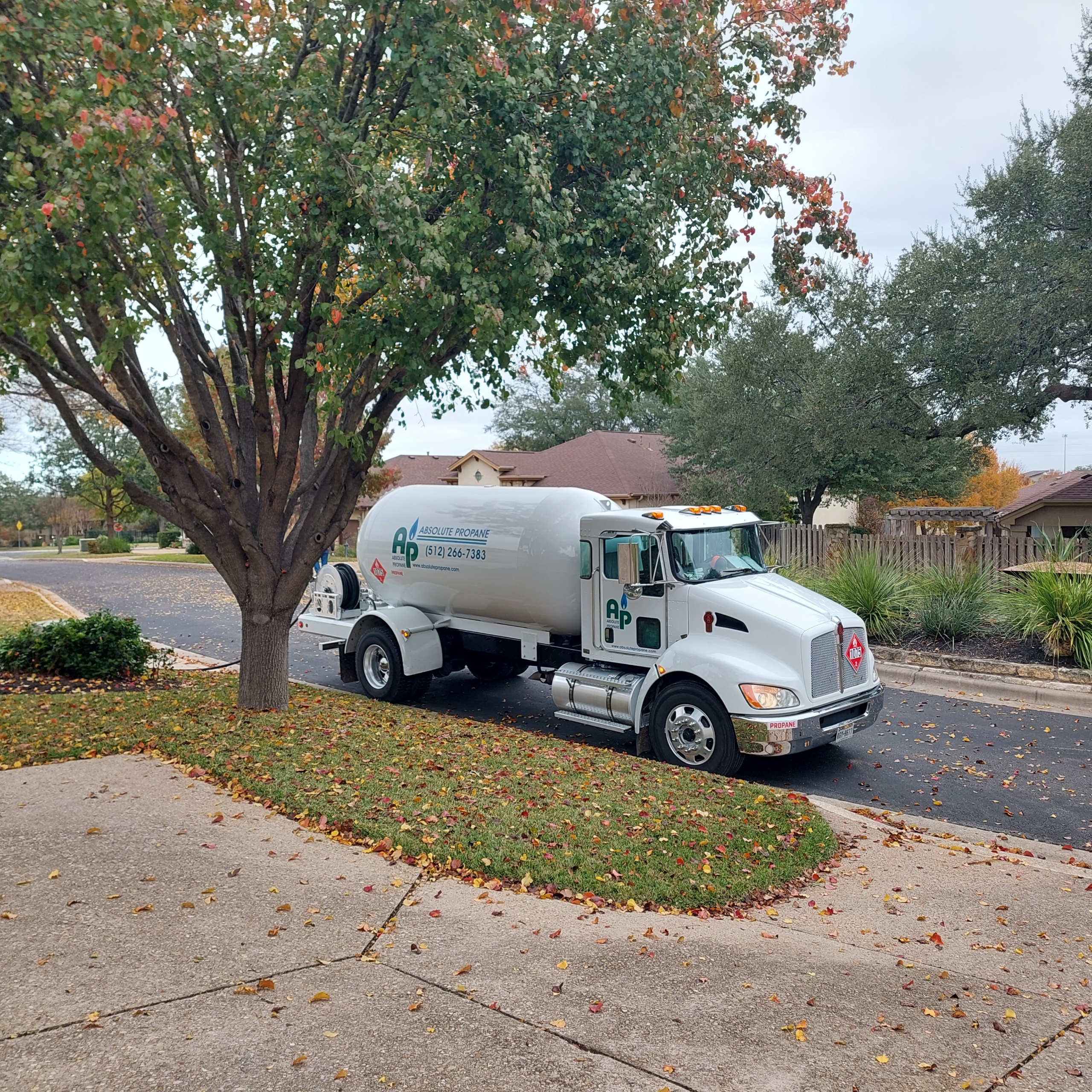 Absolute Propane delivery truck parked in a residential neighborhood in the Austin, TX area — propane delivery service